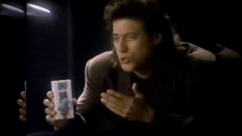 Mirrored image of Richard Lewis gesturing to BoKu juice box