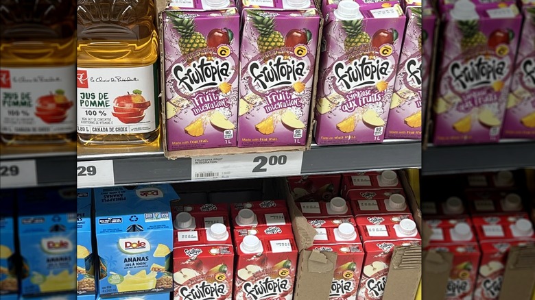 Mirrored image of Fruitopia juice boxes on grocery store shelf