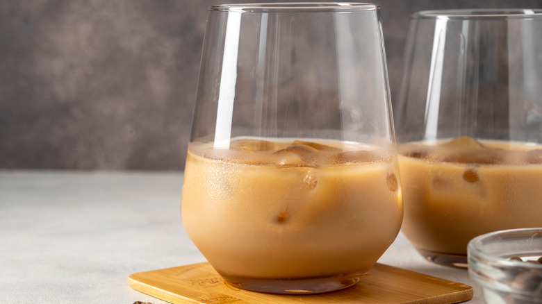 Irish cream liqueur in two glasses with ice cubes