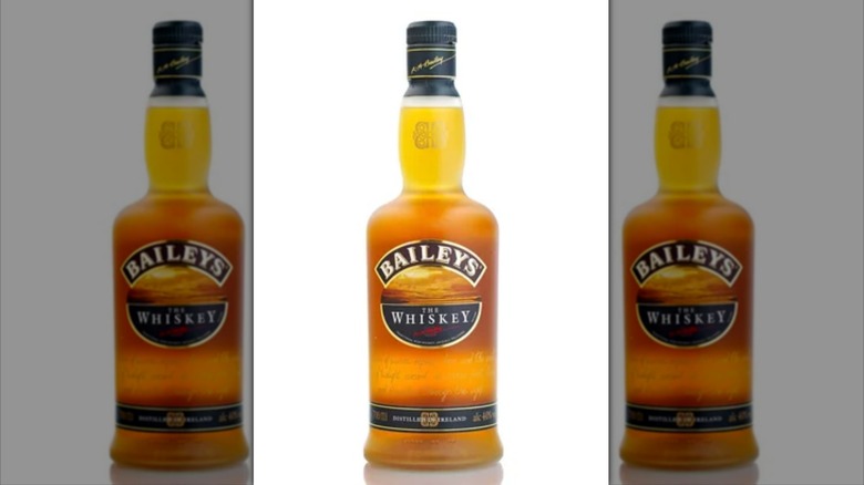 Mirrored image of Baileys Irish Whiskey on white background