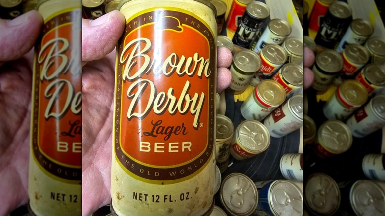 mirrored image of hand holding Brown Derby can