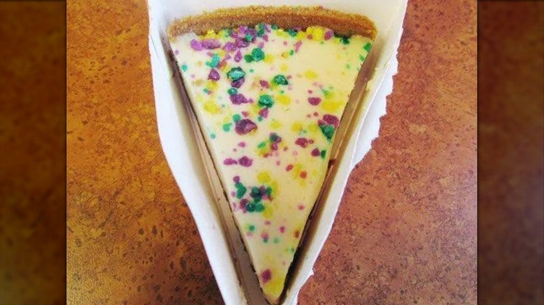Mardi Gras cheesecake on brown table