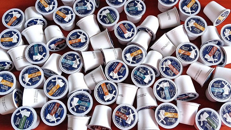 Multiple types of Dutch Bros coffee pods scattered