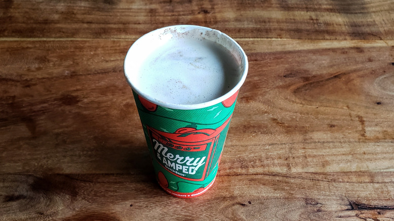 Dutch Bros Holiday Cookie Latte on a wooden table.