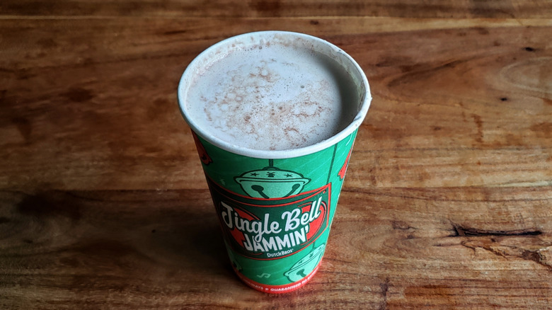 Dutch Bros Hazelnut Truffle hot cocoa on wooden table.