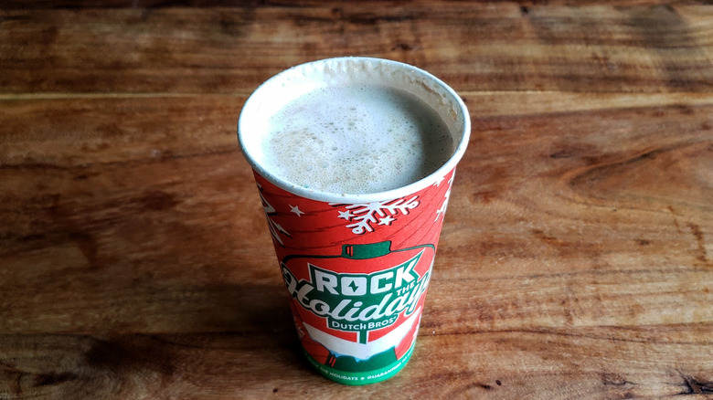 Dutch Bros Candy Cane mocha on wooden table.