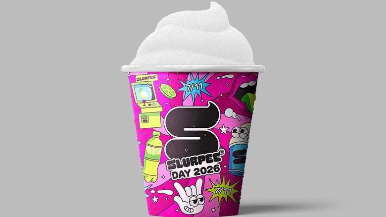 A branded Slurpee cup advertising Slurpee Day 2026 filled with white slush.