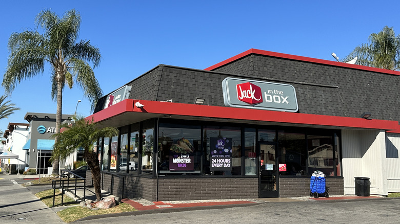 Jack in the Box restaurant next to palm tree