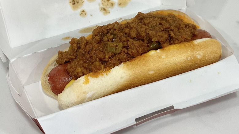 Swensons Hot Dog with Coney Sauce and Cheese in to-go box.