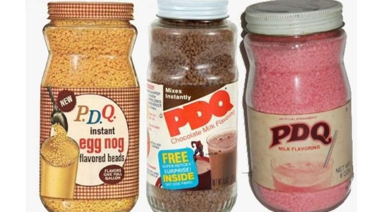 Three glass jars of various milk flavors