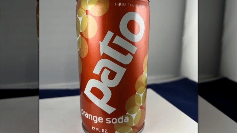 Patio can on white table, mirrored image