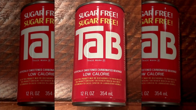 A vintage can of Tab on wooden table, mirrored image