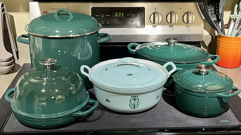 A collection of Aldi cookware on a stove top
