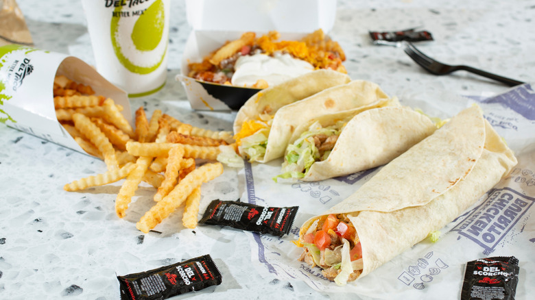 a Del Taco combo meal spread out on table