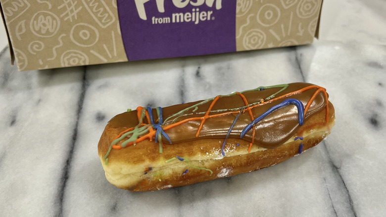 Meijer maple glazed long john with donut box.