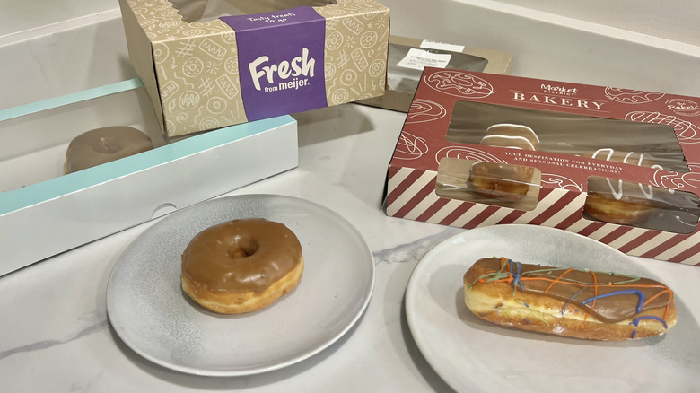 Grocery store bakery maple iced donuts and donut boxes.