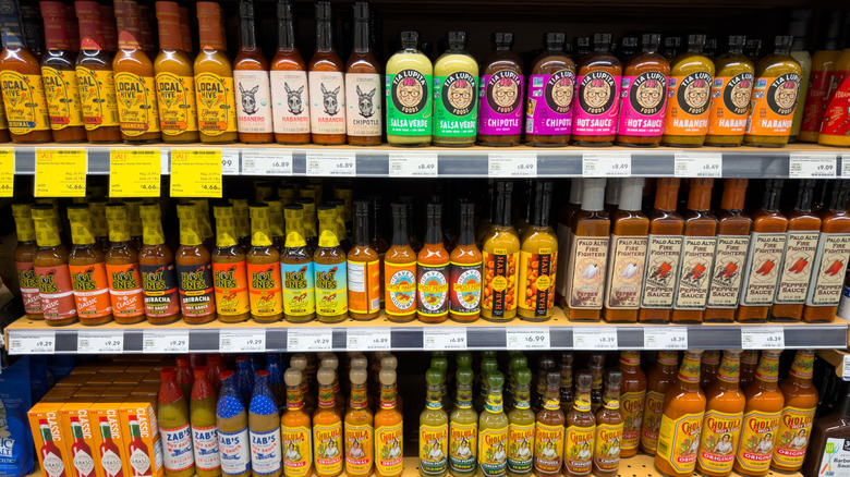 7 Hot Sauces We Always Leave On Store Shelves