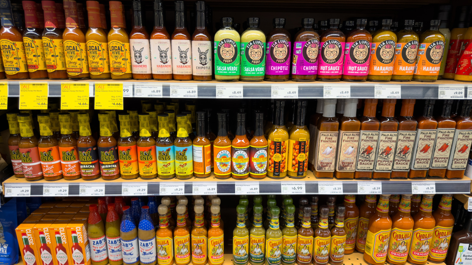 7 Hot Sauces We Always Leave On Store Shelves