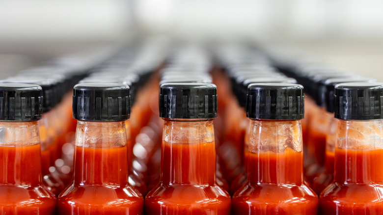 Hot sauce bottles in a factory