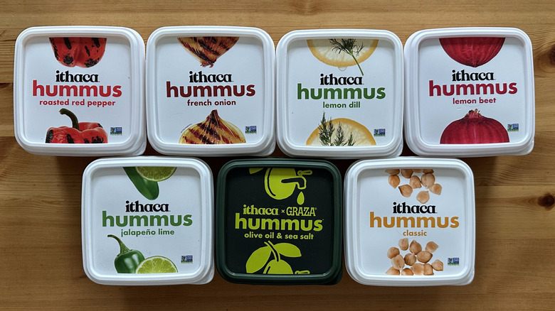 Ithaca hummus containers arranged on wooden table