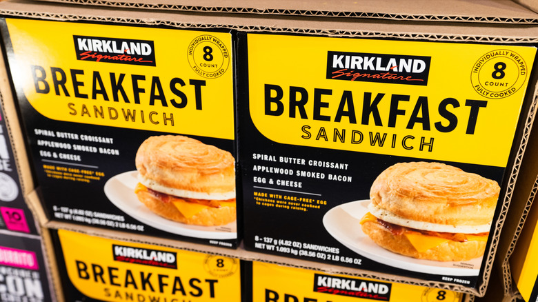 Boxes of Kirkland Signature breakfast sandwiches stacked in a cardboard box