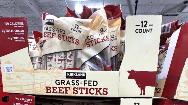 Kirkland Signature grass-fed beef sticks stacked in cardboard bins in the store