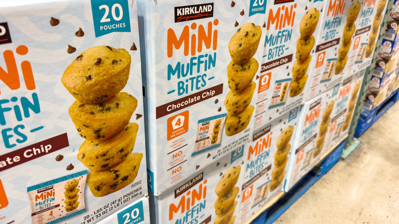 Boxes of Kirkland Signature Mini Muffin Bites stacked up in the warehouse
