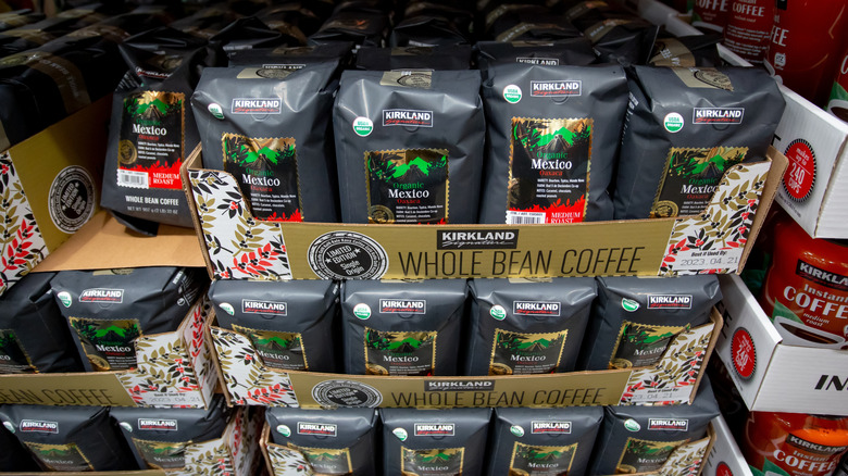 A view of bags of Kirkland Signature coffee in a Costco aisle