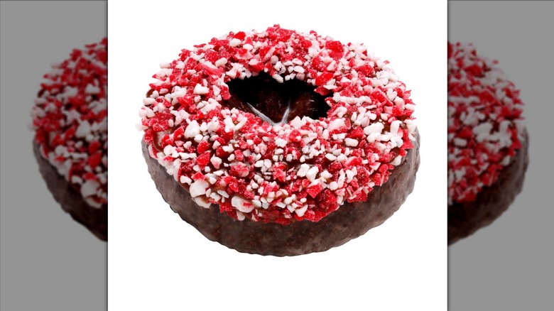 Krispy Kreme chocolate peppermint bark donut on white background