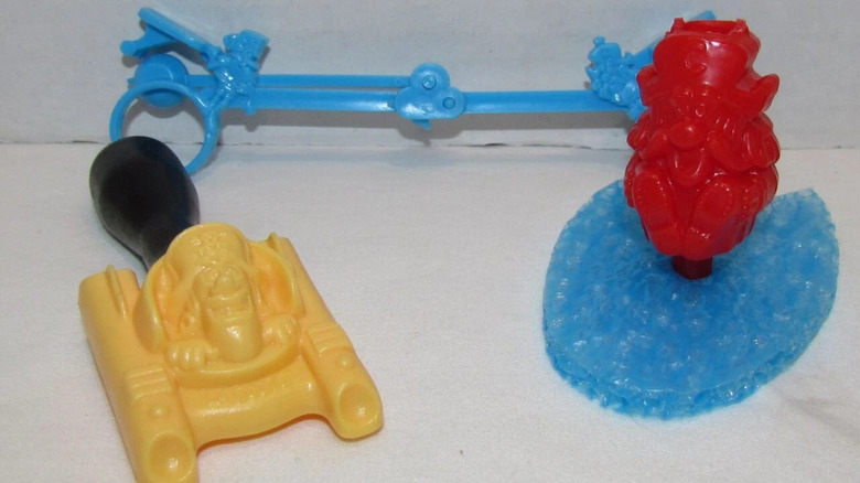 Cap'n Crunch Surfers plastic figurines on white surface