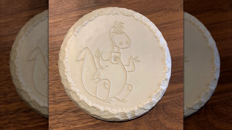 Fruity Pebbles Flying Disc toy on wood surface