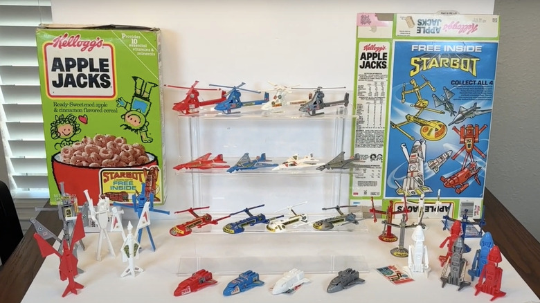 Kellogg's Starbots figurine display next to vintage boxes of Apple Jacks cereal