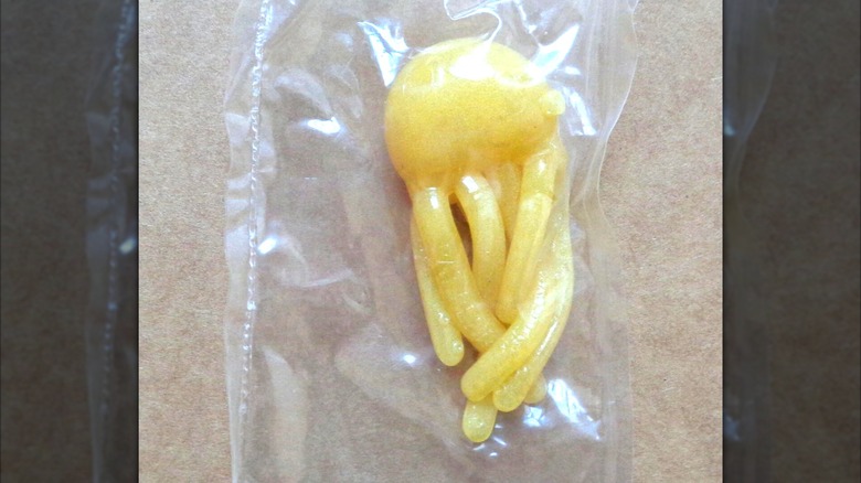 Yellow Wacky WallWalkers octopus toy in plastic bag
