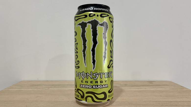 can of Monster Lando Norris on wood table with white background