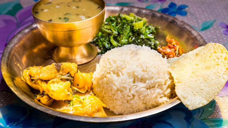 Plate of traditional Nepali dal bhat (lentil soup with rice)