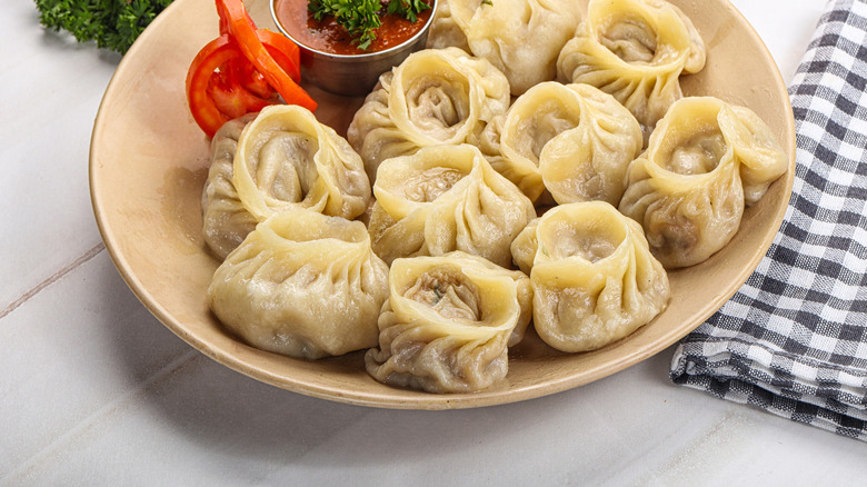 Plate of Nepali Mo:Mo dumplings with spicy dip