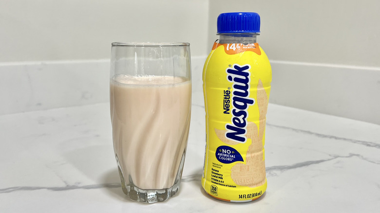 Nesquik Banana Strawberry milk in a glass.