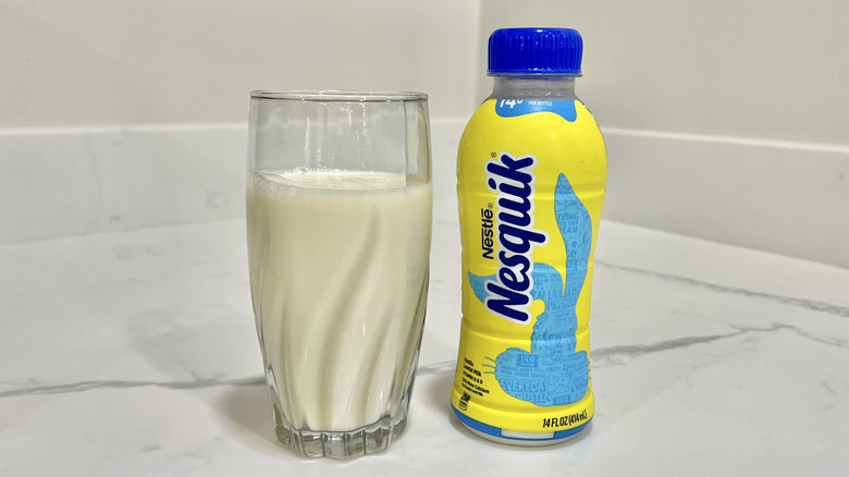 Nesquik Vanilla milk in a glass.