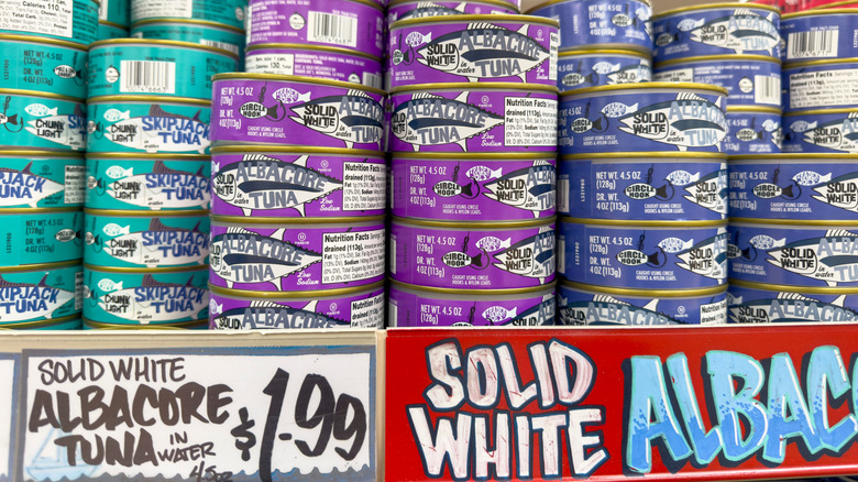 Trader Joe's shelf stacked with tuna cans