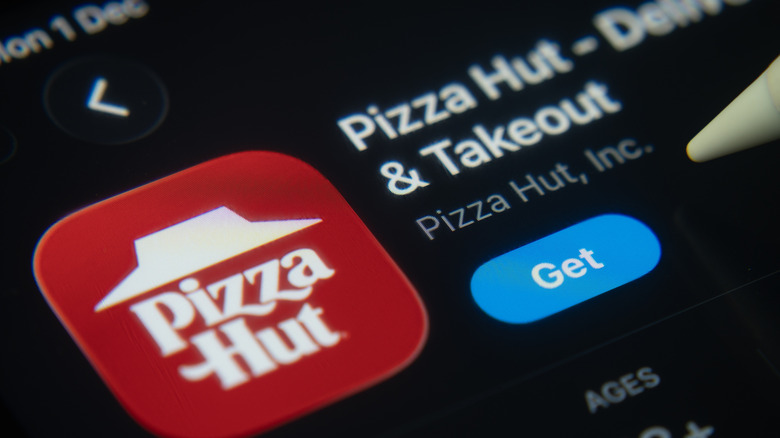 A close-up of the Pizza Hut app icon in the App Store on an iPad screen