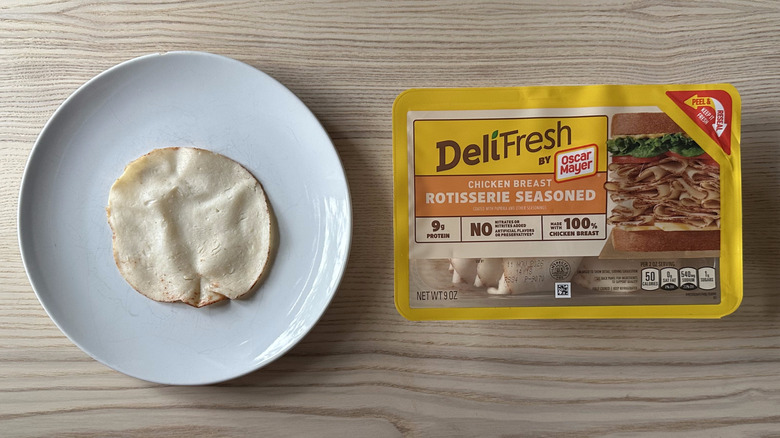 Deli Fresh Rotisserie Seasoned Chicken Breast on wooden table
