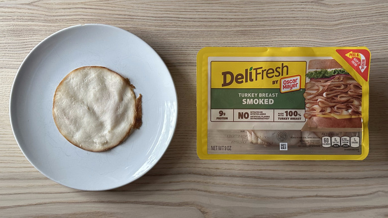 Deli Fresh Smoked Turkey Breast on wooden table