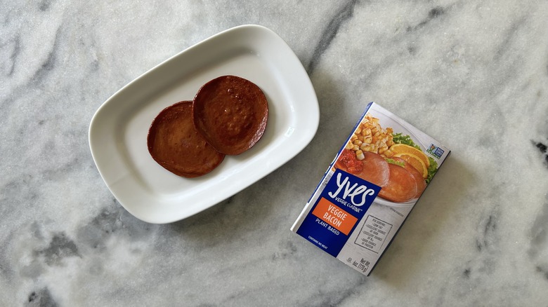 Plant-based Canadian bacon next to an Yves Veggie Cuisine package