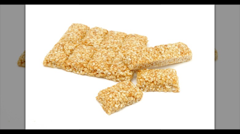 sesame seed and honey bars on white background