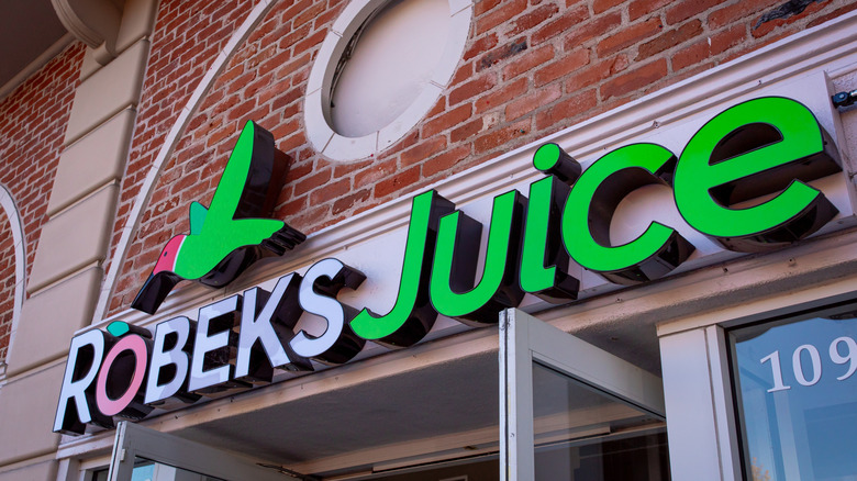 Exterior of Robeks with hummingbird logo on brick building
