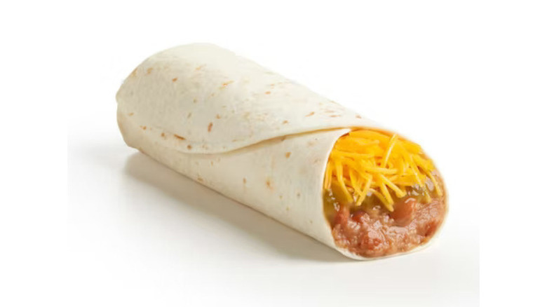 del taco green sauce burrito with cheese and beans against white background