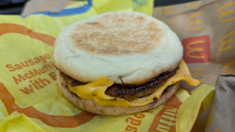 close up of McDonalds sausage mcmuffin with yellow wrapper
