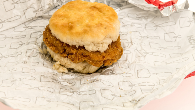 close up of Wendy's honey buddy chicken biscuit place on the wrapper