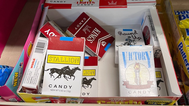a box of candy cigarette boxes on a shelf