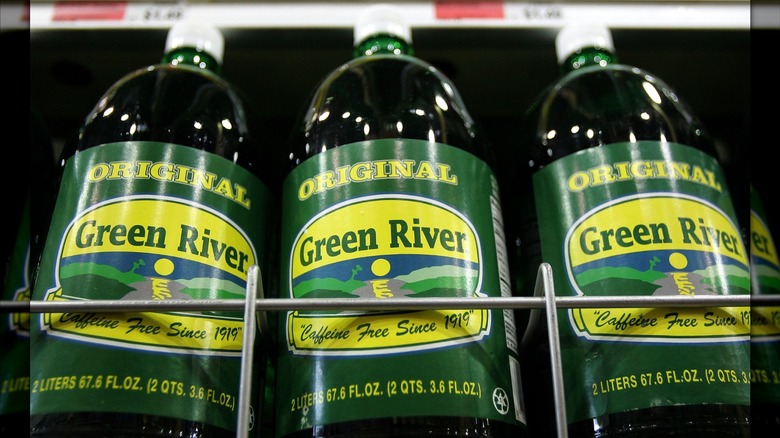 Refrigerated glass bottles of Green River lime sodas